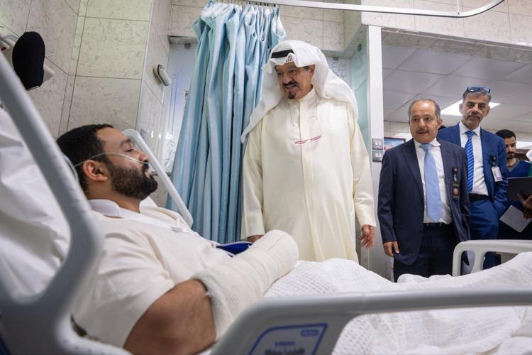 Kuwaiti Prime Minister Sheikh Ahmad Abdullah Al-Ahmad Al-Sabah visits an injured person receiving treatment at a hospital following the Iranian attack, in Kuwait City, Kuwait