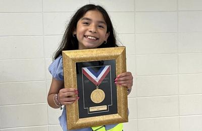 Gimena Albarran receives AAA Lifesaving Medal