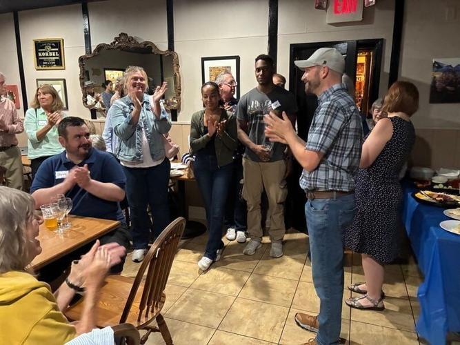 Democratic congressional candidate Mitchell Berman, right, celebrates winning the Democratic primary for Wisconsin's 1st Congressional District on Aug. 11, 2026.