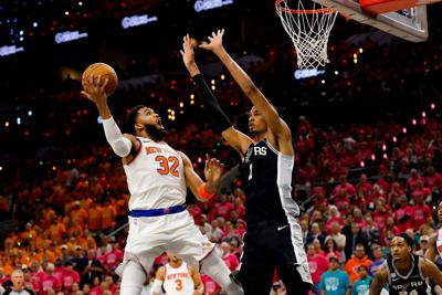 New York Knicks center Karl-Anthony Towns (32) shoots the ball over San Antonio Spurs forward Victor Wembanyama (1) during Game 1 of the NBA Finals on June 3, 2026.