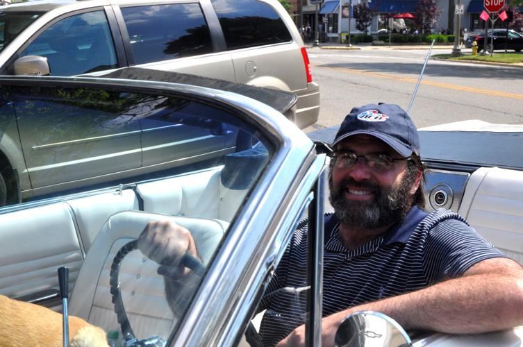 Patrick Hurst, owner of American Classic Rides, prepares to drive off in a 1963 Chevy Impala