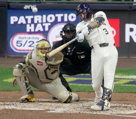 Milwaukee Brewers shortstop Joey Ortiz (3) hits a sacrifice fly during the fourth inning of their game against the San Diego