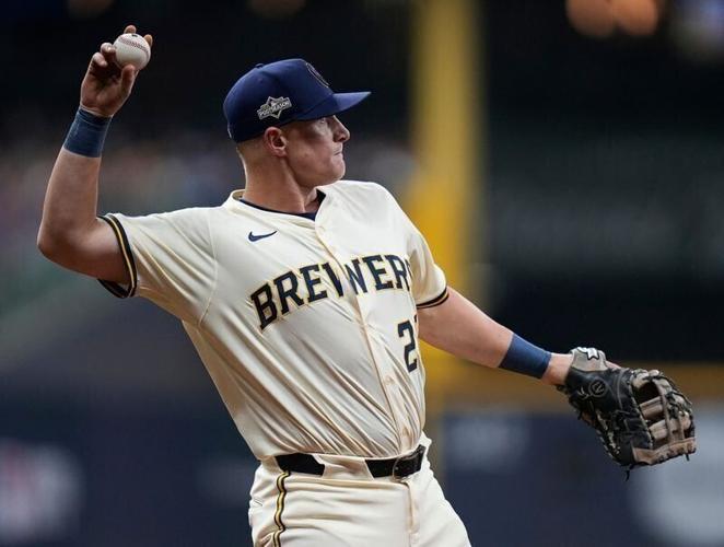Los Angeles Dodgers second baseman Tommy Edman (25) grounds out to shallow right field Milwaukee Brewers second baseman Brice Turang (2) to Milwaukee Brewers first baseman Andrew Vaughn (28) during the second inning of the of their National League Champ...