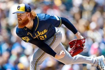 Aug 12, 2026; San Diego, California, USA; Milwaukee Brewers starting pitcher Dustin May (21) throws a pitch during the first inning against the San Diego Padres at Petco Park. Mandatory Credit: David Frerker-Imagn Images