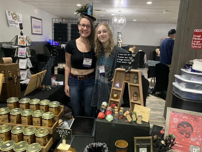 Shelby Shotwell and McKenzie Pizl sell candles, homemade dyes and dice bags at the vendor bazaar