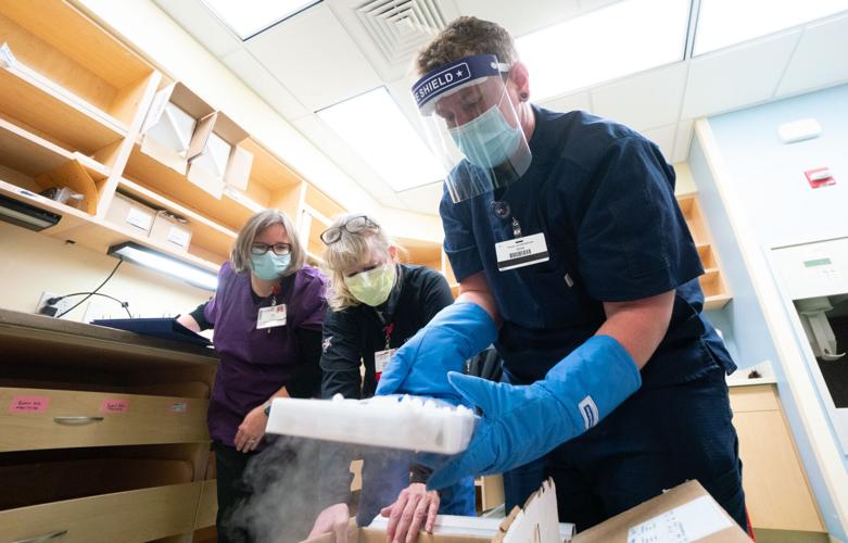 pharmacy techs handling vaccine