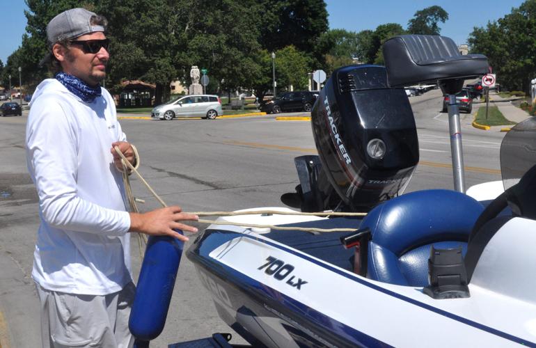 Michael Gagewicz of Darien prepares to unload his boat into Geneva Lake along Wrigley Drive