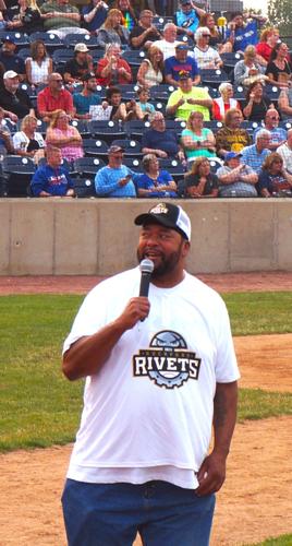 Retired Green Bay Packer Gilbert Brown revs up the Legends Celebrity Softball Game crowd at Rockford Rivets Stadium in Loves Park, Ill.
