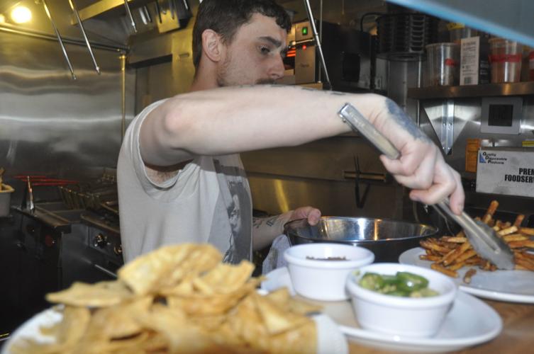 T.J. Borup prepares a meal at Flat Iron Tap