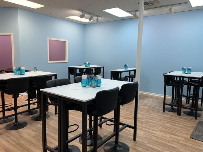 Creative Forces Art Studio features a main work area where people can paint their sculpture