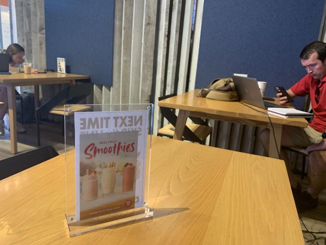 Images of Inspired Coffee drinks are placed on the tables to help entice customers to purchase the drinks