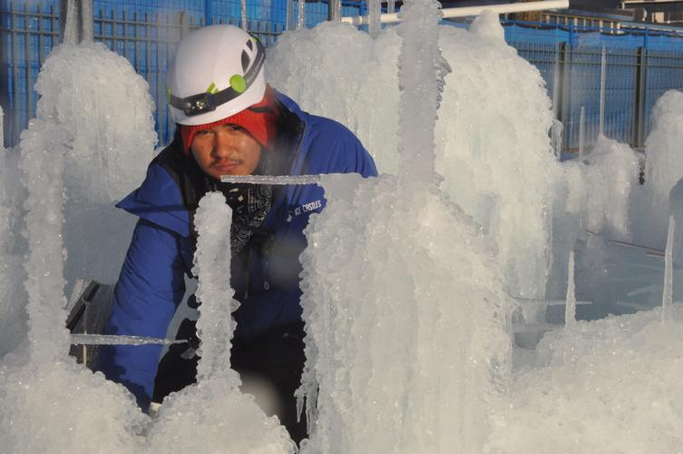 Curtis Arnold of Darien focuses on his work during the ice structure construction