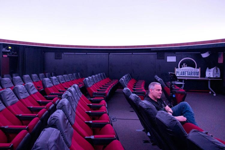 Senson in planetarium seat