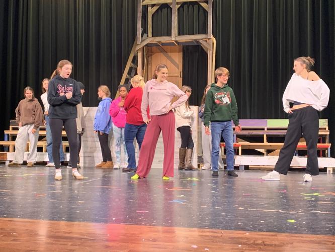 The cast members of "White Christmas the Musical" work on a dance number