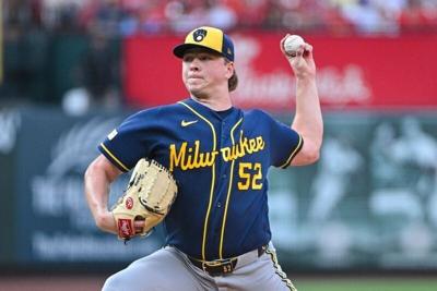 Brewers starting pitcher Kyle Harrison throws against the Cardinals during the first inning at Busch Stadium.