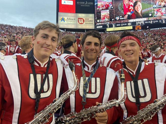 Caleb Monge, right, poses with some his fellow band members
