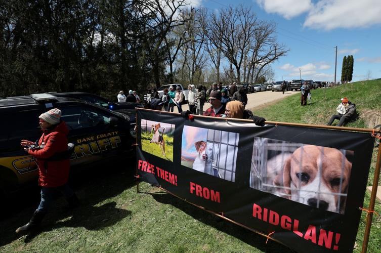 Activists hold a sign