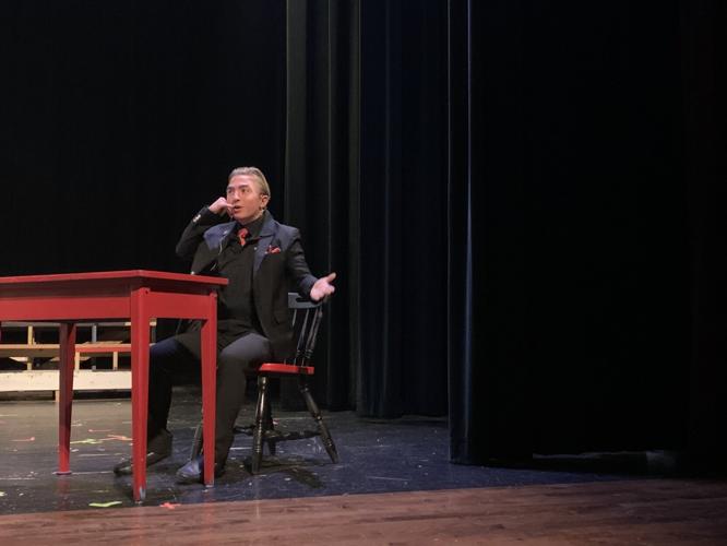Johnny Urlakis acts out taking a phone call during a scene of "White Christmas the Musical"