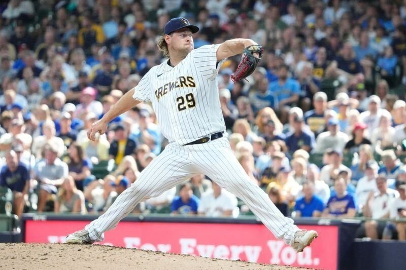 Aug 9, 2026; Milwaukee, Wisconsin, USA; Milwaukee Brewers relief pitcher Trevor Megill (29) delivers a pitch against the Minnesota Twins in the ninth inning at American Family Field. Mandatory Credit: Michael McLoone-Imagn Images