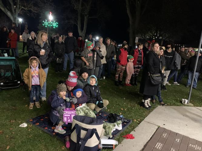 A crowd of people enjoy the entertainment