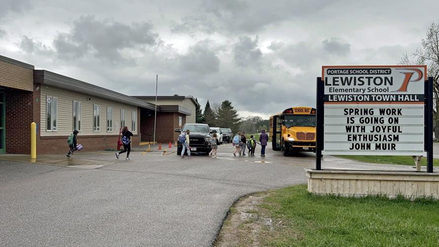 Lewiston kids leave on rainy afternoon