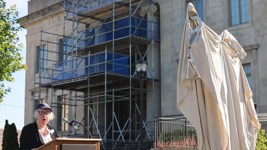 Mary Dixon next to sculpture