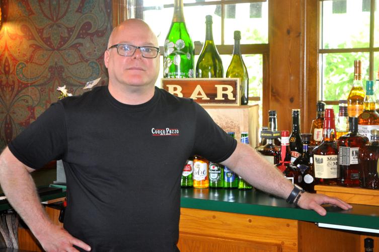 Eric Webber, owner of Cuoco Pazzo Eatz & Drinkz, 393 N. Edwards Blvd. stands in the bar area (copy)