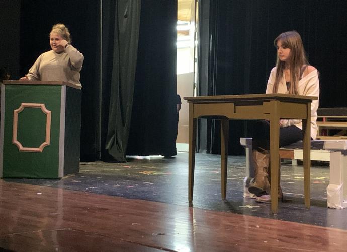 Emma Derrick, left, and Sophia Furlo rehearse a scene for the upcoming production of "White Christmas the Musical"