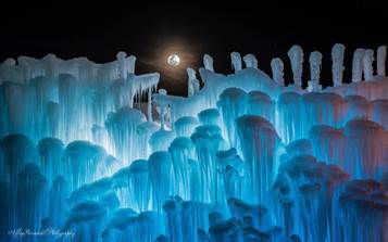 Ice castle structures in Lincoln, New Hampshire have looked impressive at night.