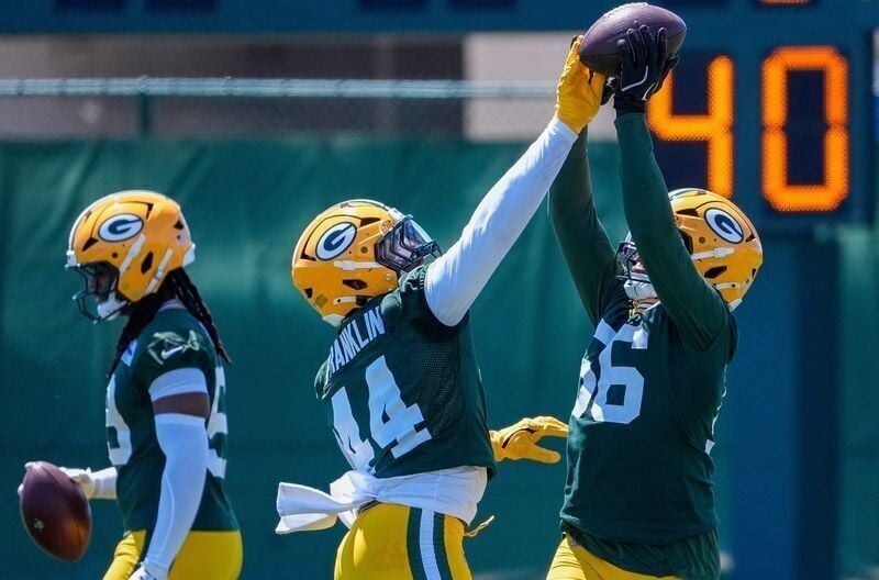 Green Bay Packers linebacker Zaire Franklin (44) tries to knock the ball away from linebacker Edgerrin Cooper (56) in a drill during practice on Tuesday, June 2, 2026, at Ray Nitschke Field in Ashwaubenon, Wis. 
Tork Mason/USA TODAY NETWORK-Wisconsin