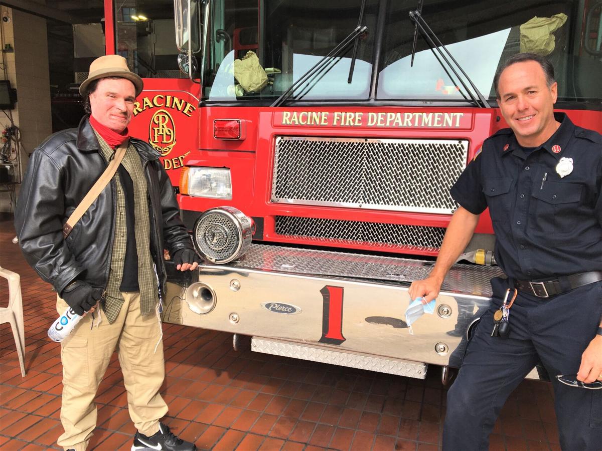 Fire survivor Joshua White and Capt. Craig Ford at Racine Fire Department Station 1