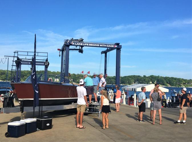 Crowd gathers to view Grand Craft's new Burnham flagship runabout at Gage Marine and PIER 290, Williams Bay