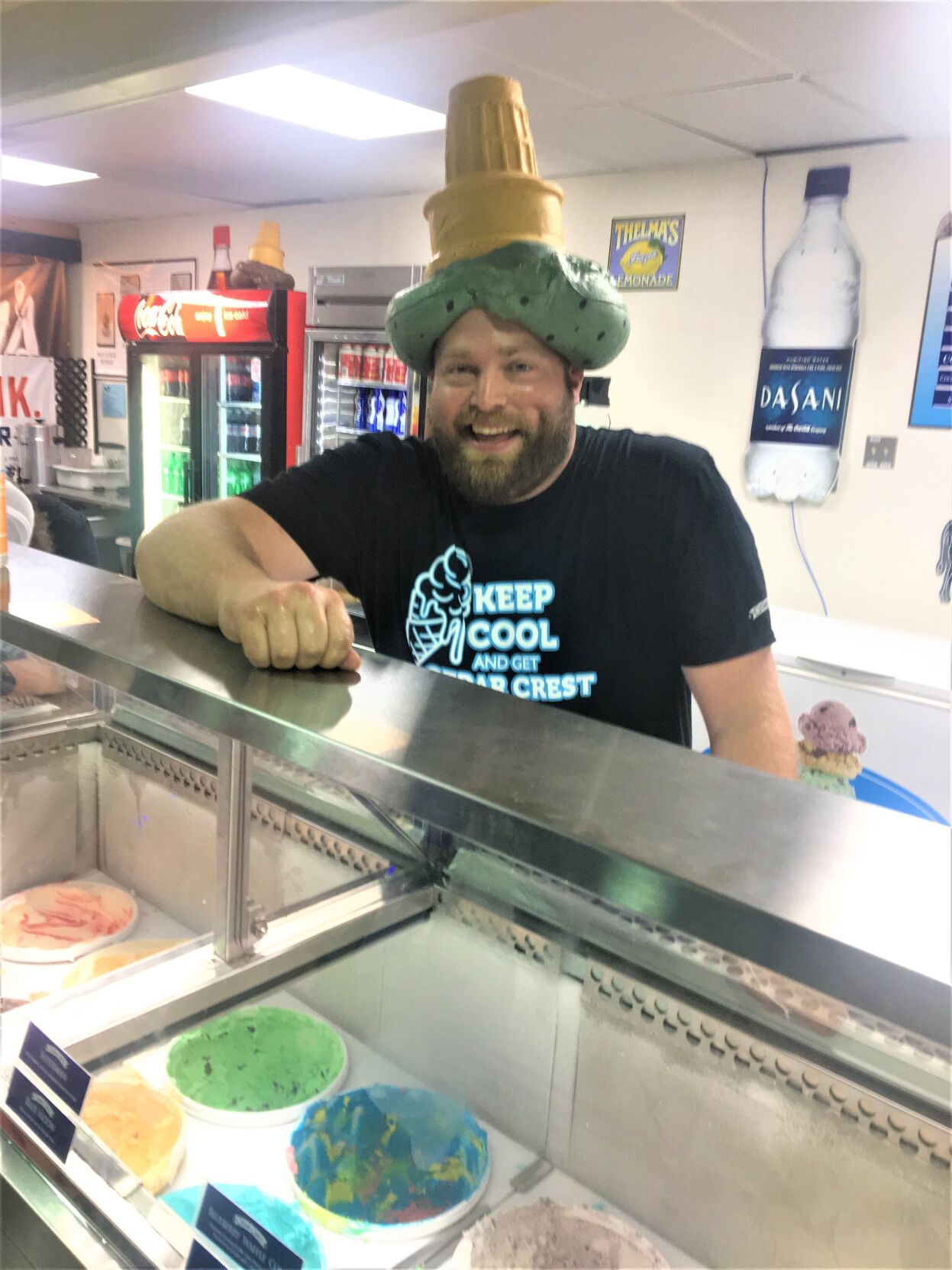 Ice cream scooper Tom Schippen at Cedar Crest Ice Cream stand at the 2022 Wisconsin State Fair