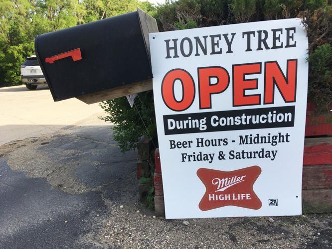 Hunny Tree Mini-Mart erects temporary sign during highway construction