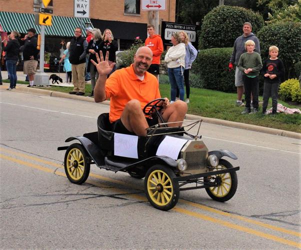Williams Bay School Board president Jack Lothian rides in the 2022 Williams Bay High School homecoming parade