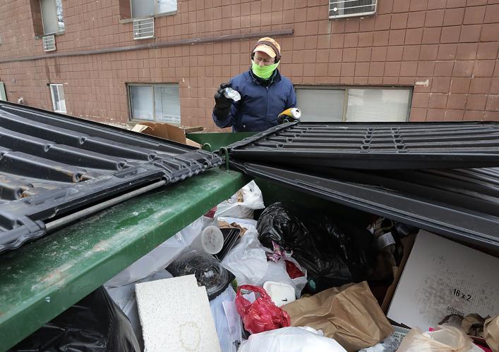 Can Collector at dumpster