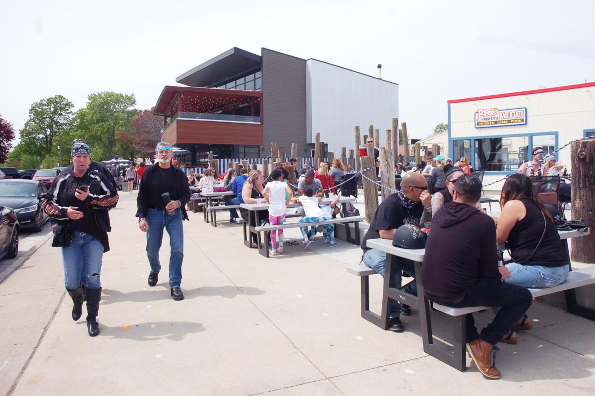 Popeye's outdoor patio fills up during first Saturday back