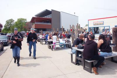 Popeye's outdoor patio fills up during first Saturday back