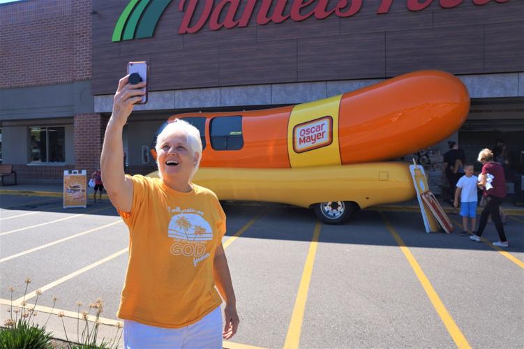 Delavan resident Grace Hirte takes a selfie photo with the Wienermobile at Daniels Foods in Walworth