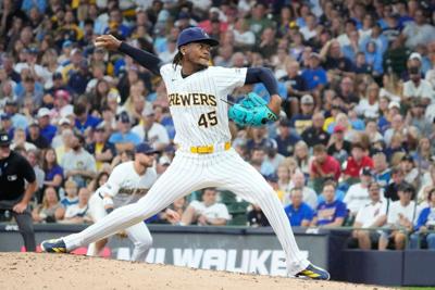 Aug 9, 2026; Milwaukee, Wisconsin, USA; Milwaukee Brewers relief pitcher Abner Uribe (45) delivers a pitch against the Minnesota Twins in the eighth inning at American Family Field. Mandatory Credit: Michael McLoone-Imagn Images