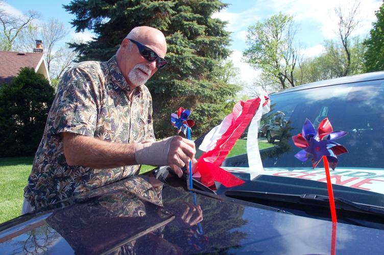 Gary Frank decorates his car for birthday parade