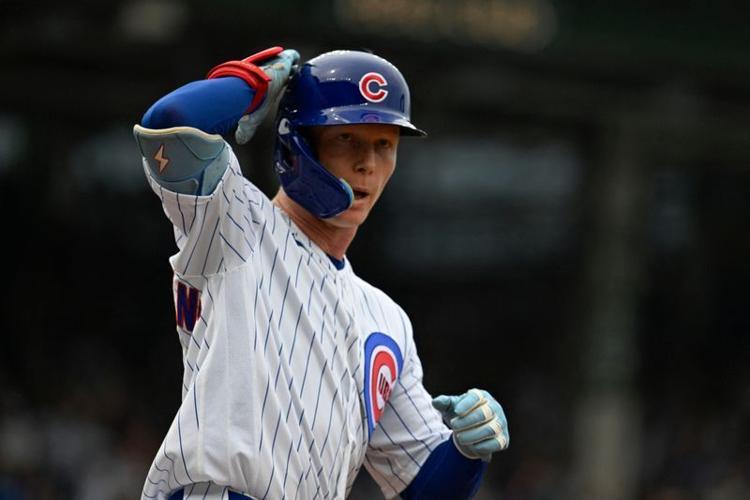 Chicago Cubs center fielder Pete Crow-Armstrong (4) gestures after hitting a two-run home run during the second inning against the Cincinnati Reds at Wrigley Field in Chicago, Illinois.