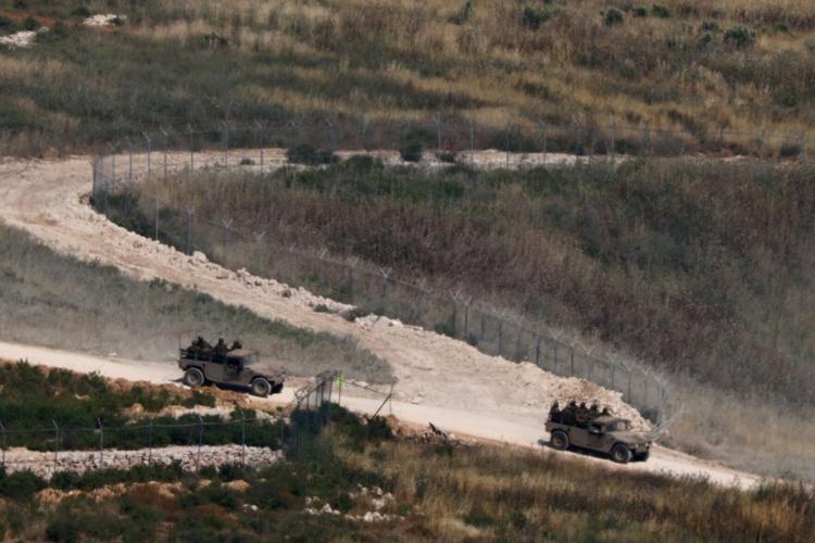 Israeli military vehicles maneuver in southern Lebanon, near the border with Israel