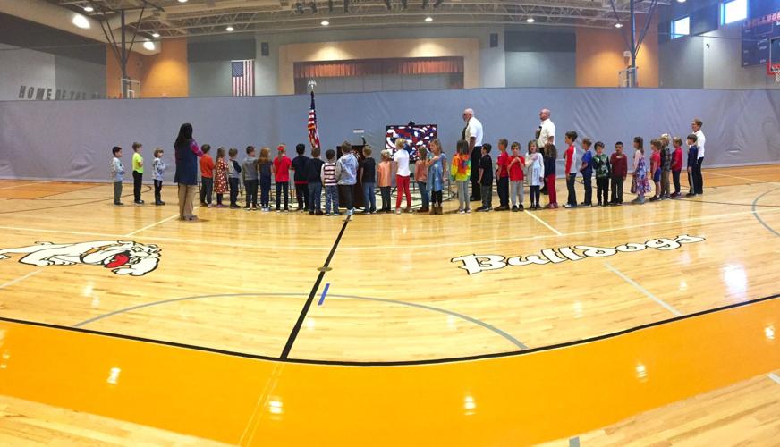 Williams Bay Elementary School first-graders lead the Pledge of Allegiance at the school's Nov. 9 Veterans Day Celebration