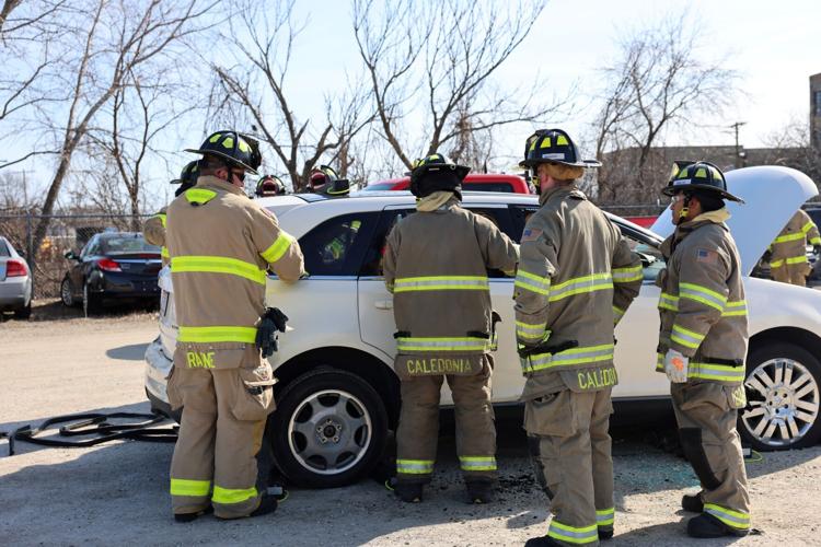 Firefighter recruits practice vehicle extrication