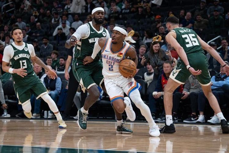 Oklahoma City guard Shai Gilgeous-Alexander pushes past Milwaukee forward Bobby Portis during their game Jan. 21. Gilgeous-Alexander, a time-time MVP, was the No. 11 pick in the 2018 NBA draft. The Bucks are looking to land a star with the No. 10 pick o...
