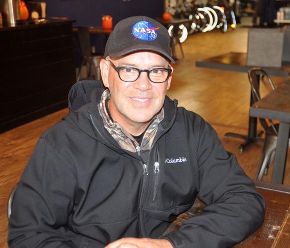 Alan Cottle of Lake Geneva proudly displays his NASA hat as a he works as a pilot for NASA's SOFIA program