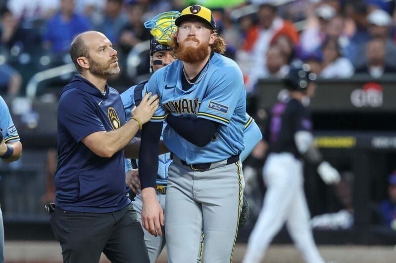 Aug 26, 2026; New York City, New York, USA;  Milwaukee Brewers starting pitcher Dustin May (21) is looked on after getting hit by a line drive in the first inning against the New York Mets at Citi Field.  Mandatory Credit: Wendell Cruz-Imagn Images