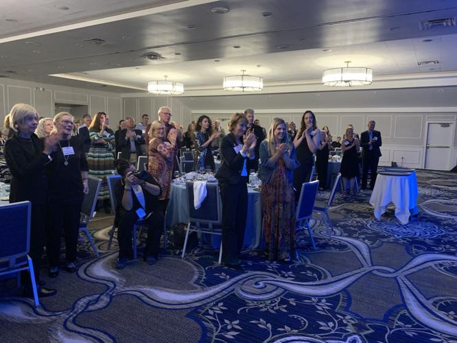 The crowd at the Visit Lake Geneva Annual Dinner & Impact Awards ceremony cheers the award winners