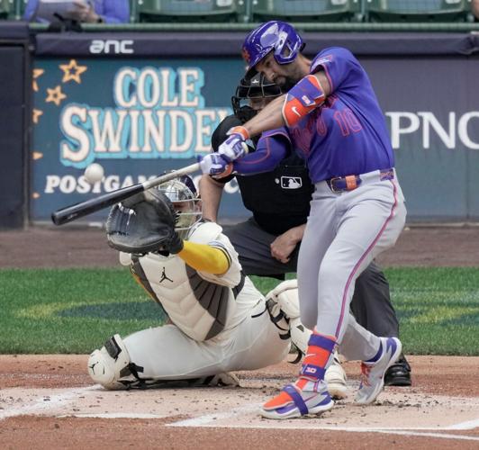 New York Mets second baseman Marcus Semien (10) hits a solo home run during the second inning of their game against the
